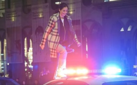 Polis maşınına dırmanan qadın  həbs edildi