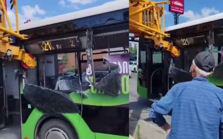 Tbilisidə Yük kranı avtobusa çırpıldı, pəncərələr və fasad dağıldı-VİDEO